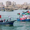Palestinians hold flags during a rally at the seaport of Gaza City marking the fifth anniversary of the “Mavi Marmara” Gaza flotilla, May 31, 2015. Photo by Aaed Tayeh/Flash90.
