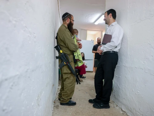 Ultra-Orthodox Jews pray inside a public shelter in northern Israel during alarms and rocket and missile fire from Iran into Israel. June 16, 2025. Photo by David Cohen/FLASH90.