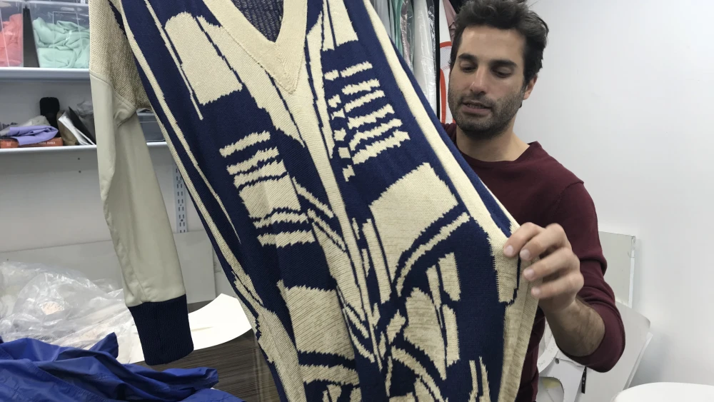 Elisha Bargel shows a piece inspired by Jewish prayer shawls. Credit: Eliana Rudee.