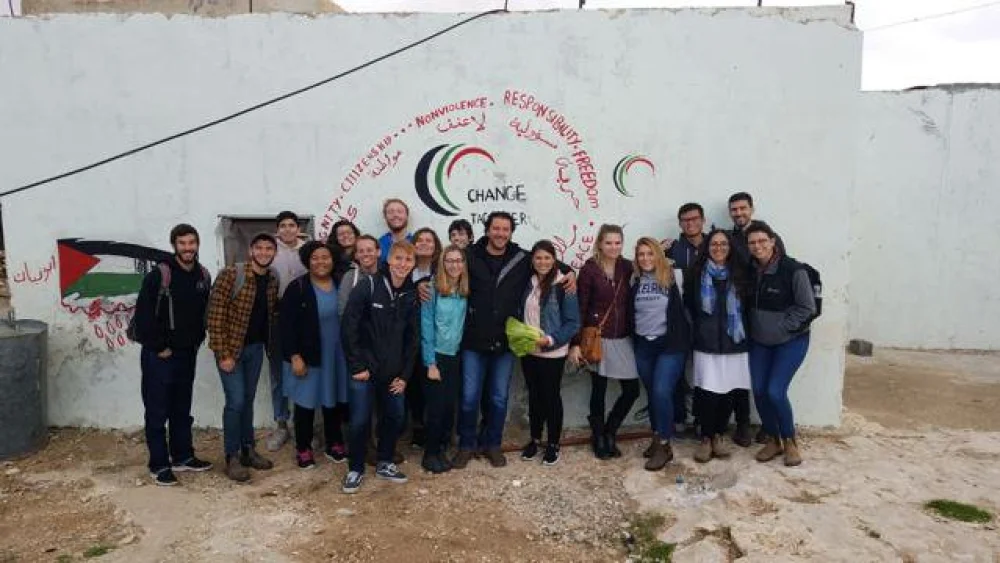 A group of students on a visit last year to the Palestinian village of Jubbet ad-Dhib, sponsored by J Street U. According to J Street U, the students “learned about life under occupation: the demolition orders, electricity and water issues, and more.” Credit: J Street U via Twitter.