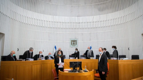 Israeli Supreme Court president Esther Hayut and Supreme Court Justices arrive to a second-day court session on petitions against the coalition agreement between Gantz's Blue and White Party and Netanyahu's Likud Party at the Supreme Court in Jerusalem on May 3, 2020. Photo by Oren Ben Hakoon/POOL.