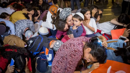 Residents of southern Israel show what it's like when they experience a Red Alert rocket warning, during a protest calling for better security, at the entrance to Tel Aviv on Oct. 28, 2018. Photo by Miriam Alster/Flash90.
