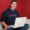 Facebook founder Mark Zuckerberg with his laptop. Credit: Wikimedia Commons.