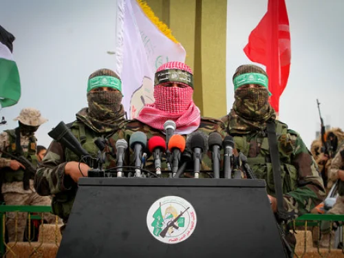 Abu Ubaida (center), a spokesman for Hamas’s “military wing,” speaks in the southern Gaza town of Rafah on Jan. 31, 2017. Credit: Abed Rahim Khatib/Flash90.