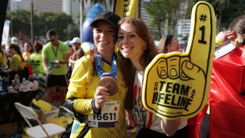 Tzipora Grodko (left) celebrates her completion of the Miami Marathon with her friend Esti Caplan, who flew in to cheer her on. Credit: Courtesy.