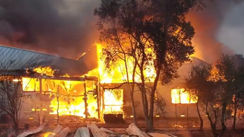 A view of a home burning in the Kincade Fire in Northern California, October 2019. Source: Screenshot.