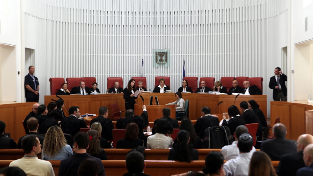 Eleven Israeli Supreme Court Justices deliberate on a petition related to Palestinian Arabs submitted by HaMoked, among other NGOs. Photo by Yossi Zamir/Flash 90.