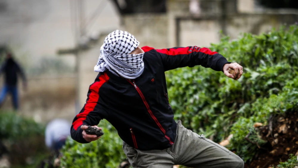 Palestinians clash with Israeli security forces during a protest in the village of Kfar Qaddum, near the West Bank city of Nablus on March 13, 2020. Photo by Nasser Ishtayeh/Flash90.