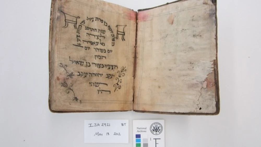 Before treatment by the National Archives and Records Administration, a Passover Haggadah from 1902 recovered from the Mukhabarat, Saddam Hussein’s Intelligence Headquarters. The haggadah is part of what has become known as the Iraqi Jewish Archive. Credit: National Archives and Records Administration.