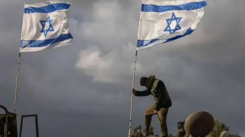 A convoy of armored personnel carriers is seen near the Gaza border, Nov. 20, 2023. Photo by Chaim Goldberg/Flash90.