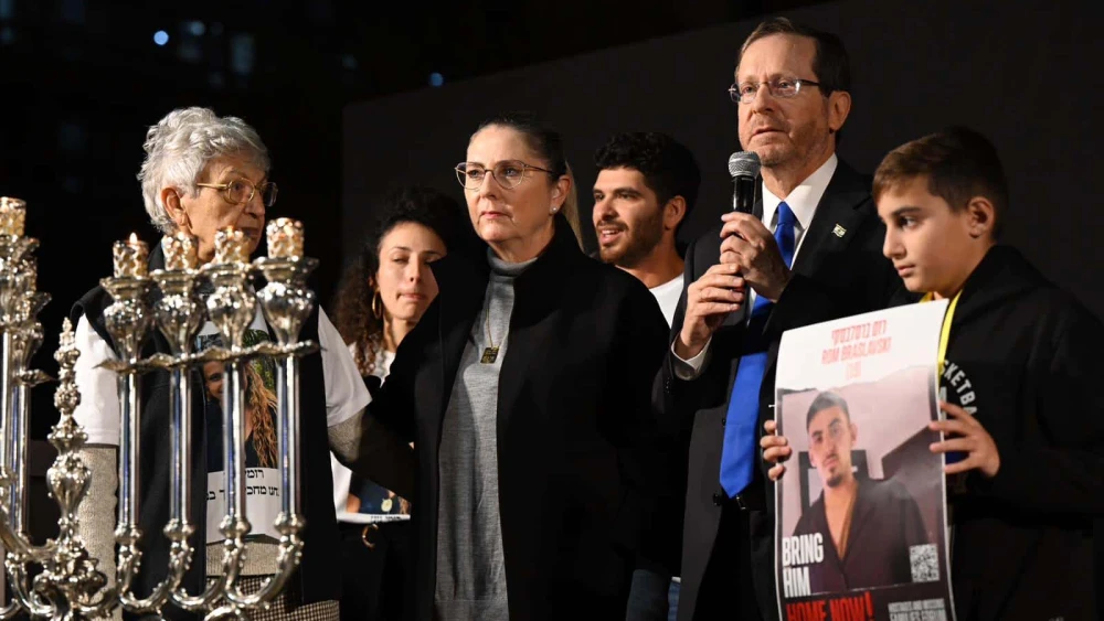 Israeli President Isaac Herzog lights Chanukah candles at “Hostage Square” in Tel Aviv, Dec. 14, 2023. Photo by Haim Zach/GPO.