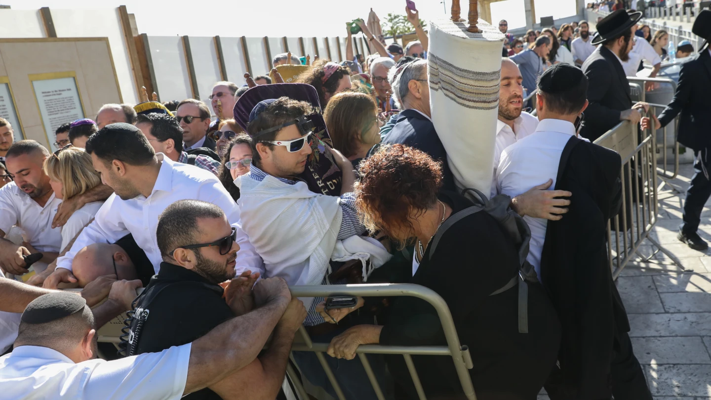 Members of the Reform movement and Hebrew Union College confront police and security guards while trying to enter a mixed men and women prayer area at the public square in front of the Western Wall in Jerusalem's Old City on Nov. 16, 2017.