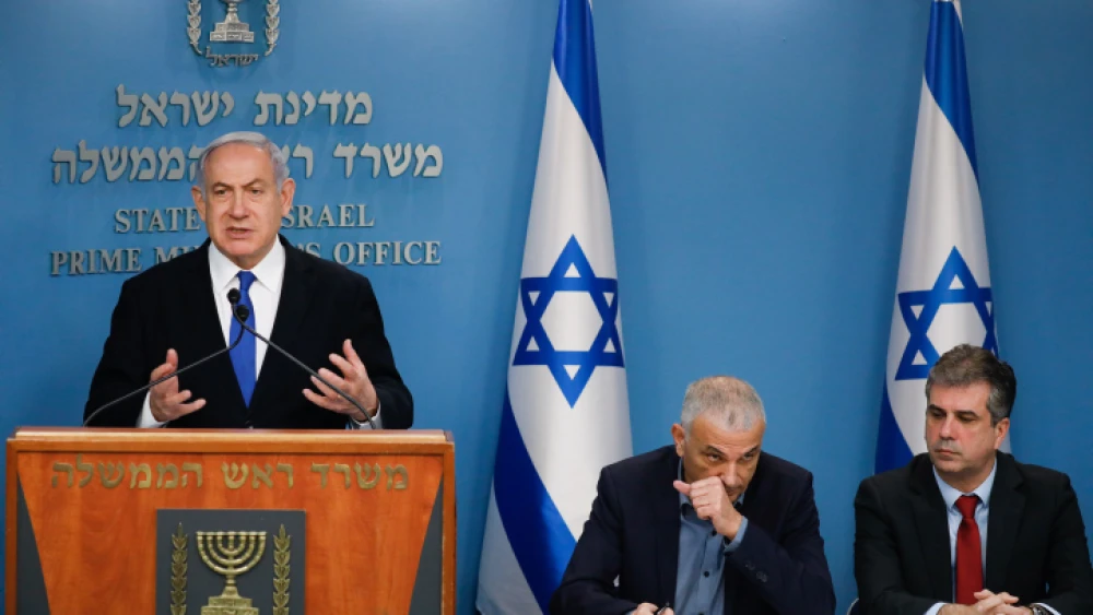Israeli Prime Minister Benjamin Netanyahu holds a press conference with Finance Minister Moshe Kahlon, Economics Minister Eli Cohen and Bank of Israel head Amir Yaron (not seen) at the Prime Minister's Office in Jerusalem on the economic preparations for the financial fallout of the coronavirus pandemic. Photo by Olivier Fitoussi/Flash90.