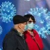 Passersby outside a COVID-19 vaccination center in Jerusalem, on Dec. 31, 2020. Photo by Olivier Fitoussi/Flash90.