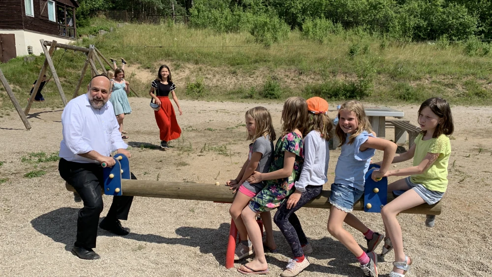 The rabbi with children at Poland’s Camp ATID. Credit: Courtesy.