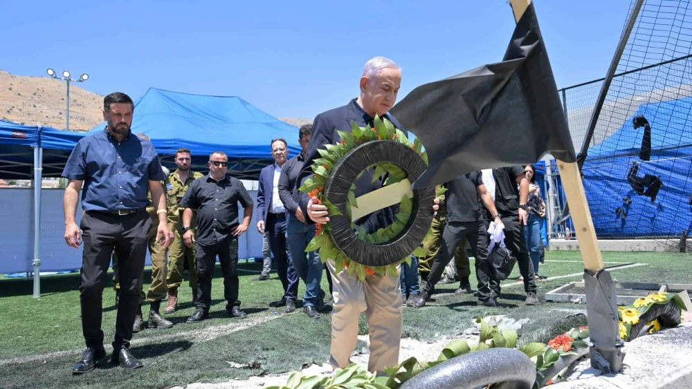 Israeli Prime Minister Benjamin Netanyahu lays a wreath at the site of a deadly Hezbollah rocket attack in Majdal Shams in the Golan Heights, July 29, 2024. Photo by Kobi Gideon/GPO.
