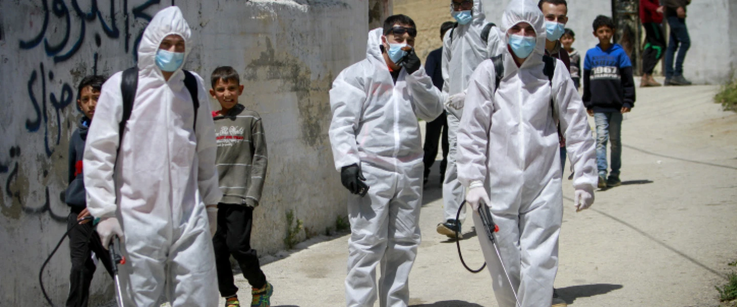 Palestinian workers clear streets and homes in the West Bank city of Nablus on April 3, 2020, enabling measures to prevent the spread of COVID-19. Photo by Nasser Ishtayeh/Flash90.