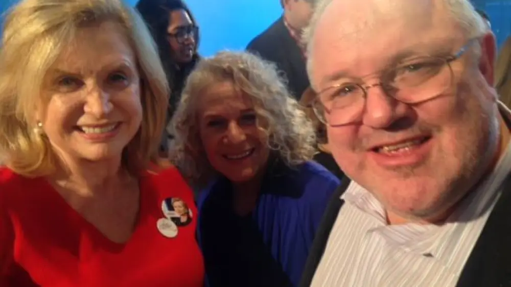 Marc Daniels with musician Carol King at a Hillary Clinton campaign event in 2016. Credit: Courtesy.