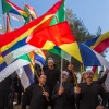 Druze men protest outside the Hafia District Court, carrying both the Druze and the Israeli flags. Photo by Flash90.