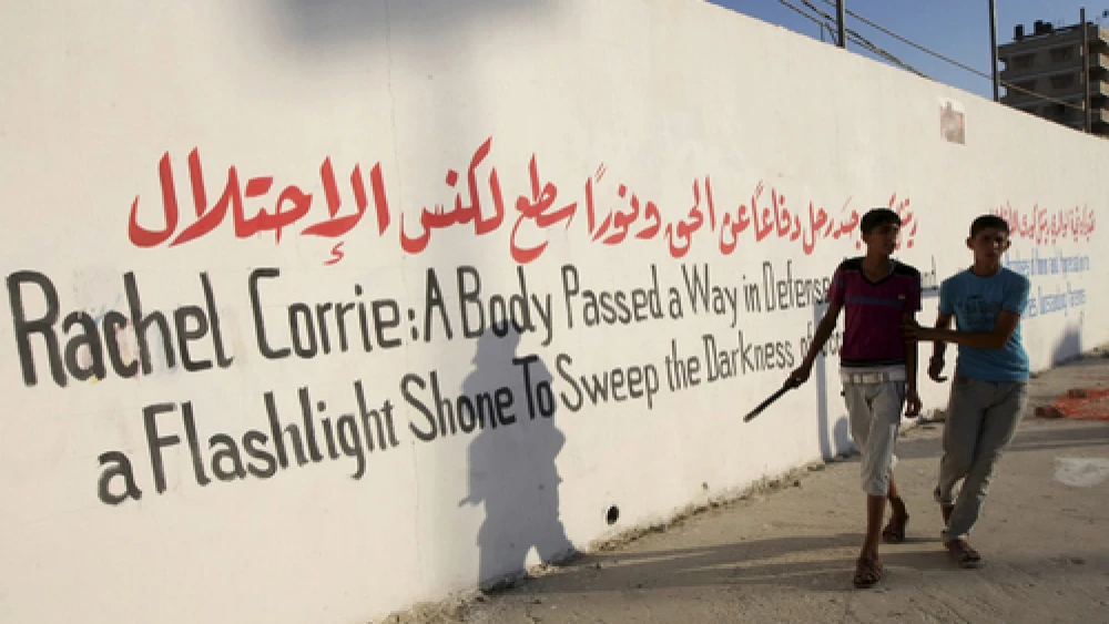 Palestinians hold pictures of Rachel Corrie in the southern Gaza Strip on July 28 at the end of a local football match named the "Rachel Corrie Cup", in honor of the U.S. activist who was run over by an Israeli bulldozer at a pro-Palestinian demonstration in 2003. Photo by Abed Rahim Khatib/Flash90.