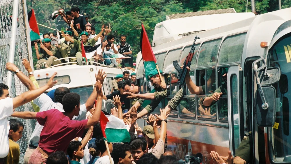 Palestinian policemen are celebrating on their entrance to the city of Jericho.Friday May 13 1994. It was one of the first cities handed over to Palestinian Authority control in 1994, in accordance with the Oslo accords. CredIt: Yossi Zamir/Flash 90