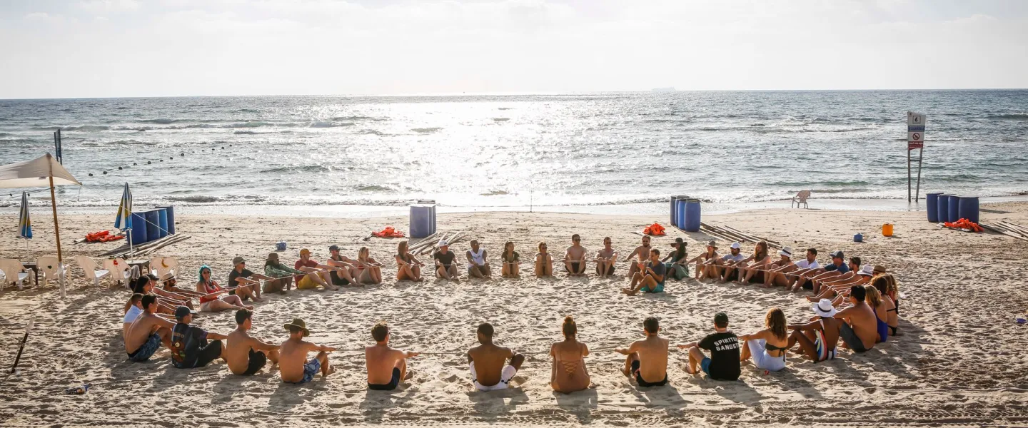 Emerging REALITY group participating in team building activities on Banana Beach in Michmoret. Credit: Schusterman Family Foundation.