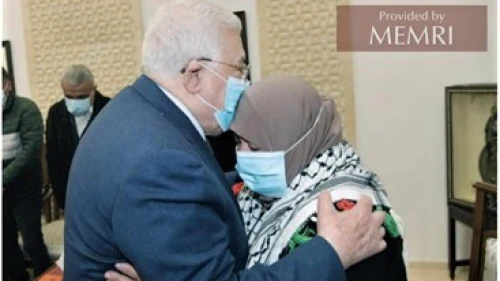 Palestinian Authority leader Mahmoud Abbas embraces Latifa Abu Hmeid, the mother of six terrorists as confirmed by Israel, during a meeting in Ramallah on Jan. 12, 2022. Source: Al-Hayat Al-Jadida, Jan. 13, 2022. Credit: MEMRI.