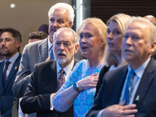 Janet Huckabee, third from right, and her husband Mike Huckabee and Mike Evans sing the American anthem at the Friends of Zion Heritage Center in Jerusalem, Israel on May 6, 2025. Photo by David Sa'ad.