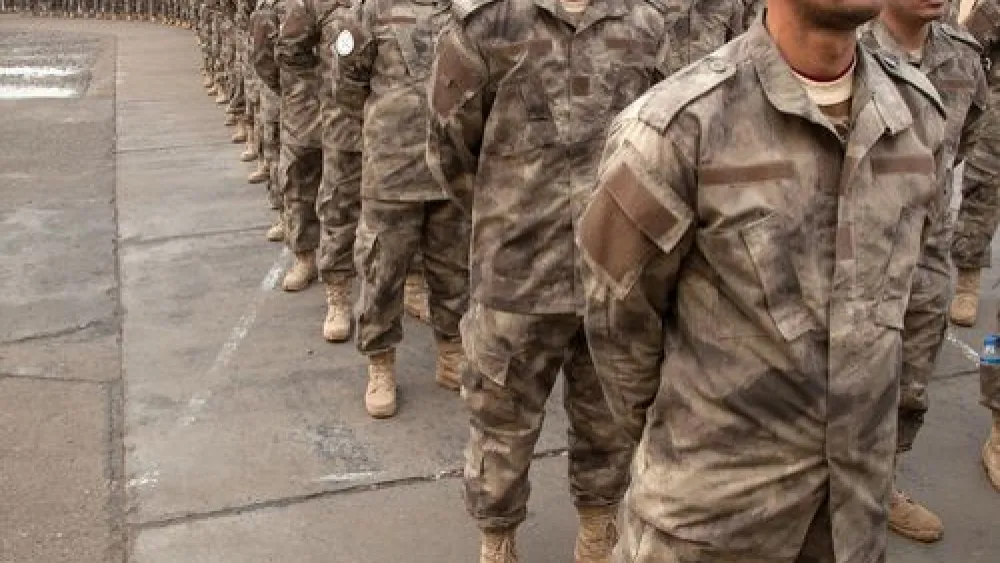 Click photo to download. Caption: Soldiers from the Nineveh Plains Protection Units, a military organization created last year in Iraq to defend and retake Assyrian Christian land conquered by Islamic State. Credit: Jeff Gardner, picturechristians.org.