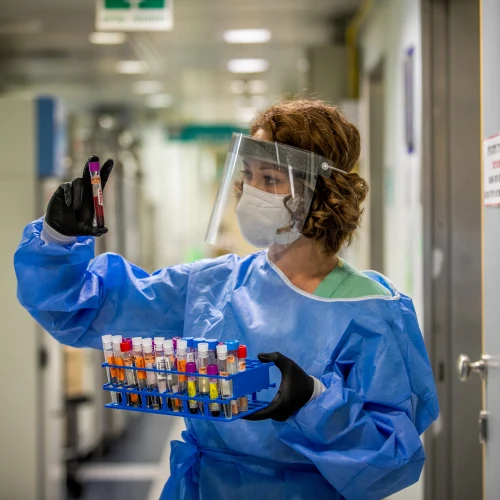 A technician carries out a diagnostic test for coronavirus in a lab at the Ichilov Hospital in Tel Aviv on Aug. 3, 2020. Photo by Yossi Aloni/Flash90.
