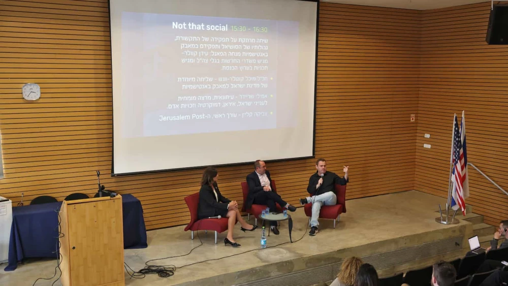 Michal Cotler-Wunsh, Israel’s special envoy for combating antisemitism at the Ministry of Foreign Affairs, Zvika Klein, editor-in-chief of “The Jerusalem Post,” and GLZ (IDF) radio’s Idan Kweller speak on a panel at the symposium. Photo by Yaniv Kopel.