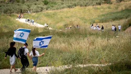 Israelis participate in a march to celebrate Israel's 71st Independence Day near Havat Gilad in Judea and Samaria on May 9, 2019. Photo by Hillel Maeir/Flash90.