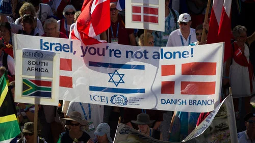 Evangelical Christians wave their national flags alongside the Israeli flag as they march in Jerusalem for International Christian Embassy Jerusalem’s Feast of Tabernacles celebration in October 2016. Credit: Sebi Berens/Flash90.