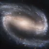 NGC 1300, a spiral galaxy, as photographed by the Hubble telescope. Credit: NASA, ESA, and The Hubble Heritage Team STScI/AURA.