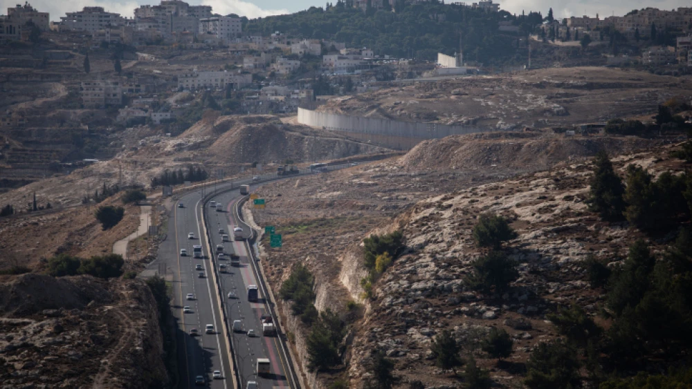 The Ma'ale Adumim-Jerusalem road, from the Judean Desert area known as E1, with Jerusalem's Mount Scopus seen on the horizon, Dec. 10, 2019. Photo by Hadas Parush/Flash90.