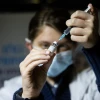 A medical worker prepares a COVID-19 vaccine injection at a vaccination center in Jerusalem, Feb. 4, 2021. Photo by Yonatan Sindel/Flash90.