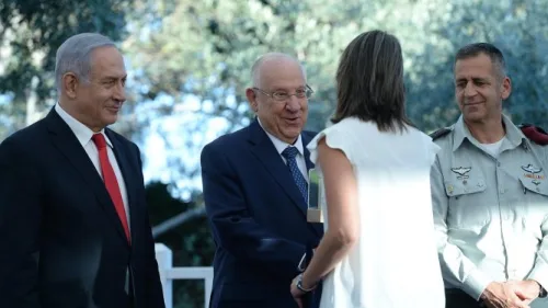 From left: Prime Minister Benjamin Netanyahu, President Reuven Rivlin, and IDF Chief of Staff Lt. Gen. Aviv Kochavi congratulate one of the recipients of this year's Israel Defense Prize at the Prime Minister's Resident in Jerusalem on July 2, 2019. Photo: GPO/Haim Zach.