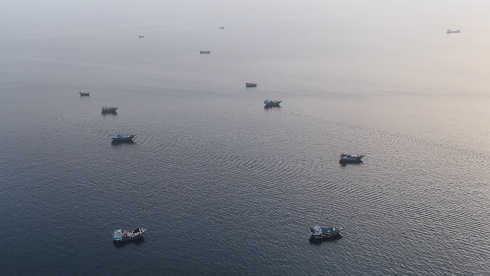 Ships anchored off Oman's northern Musandam Peninsula near the Strait of Hormuz, June 27, 2026. Photo by AFP via Getty Images.