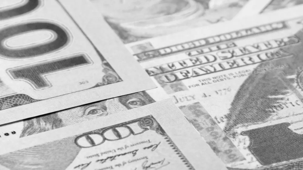 Close-up of $100 bills. Credit: Adrian Vieriu/Pexels.