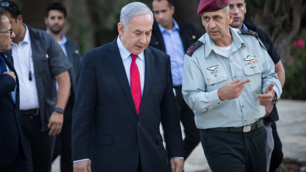 Israeli Prime Minister Benjamin Netanyahu speaks with IDF Chief of Staff Lt. Gen. Aviv Kochavi during an event honoring outstanding IDF reservists, at the President's Residence in Jerusalem on July 1, 2019. Photo by Hadas Parush/Flash90.