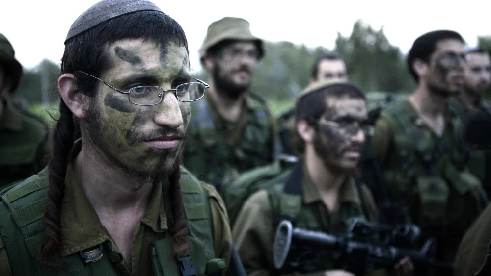 Infantrymen in the IDF's Orthodox Netzah Yehuda (“Nahal Haredi”) Battalion complete the final stages of a 40-kilometer march, Feb. 16, 2010. Photo by Abir Sultan/Flash90.