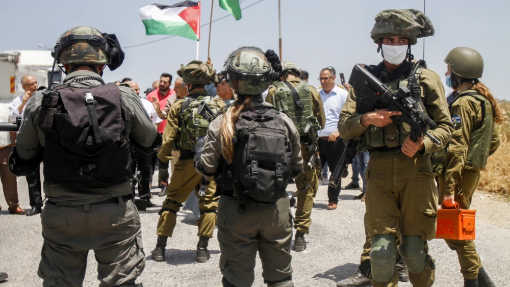 Israeli security forces guard a Palestinian protest in the West Bank against the Jewish state's plans to declare sovereignty over parts of Judea and Samaria. June 5, 2020. Photo by Nasser Ishtayeh/Flash90.
