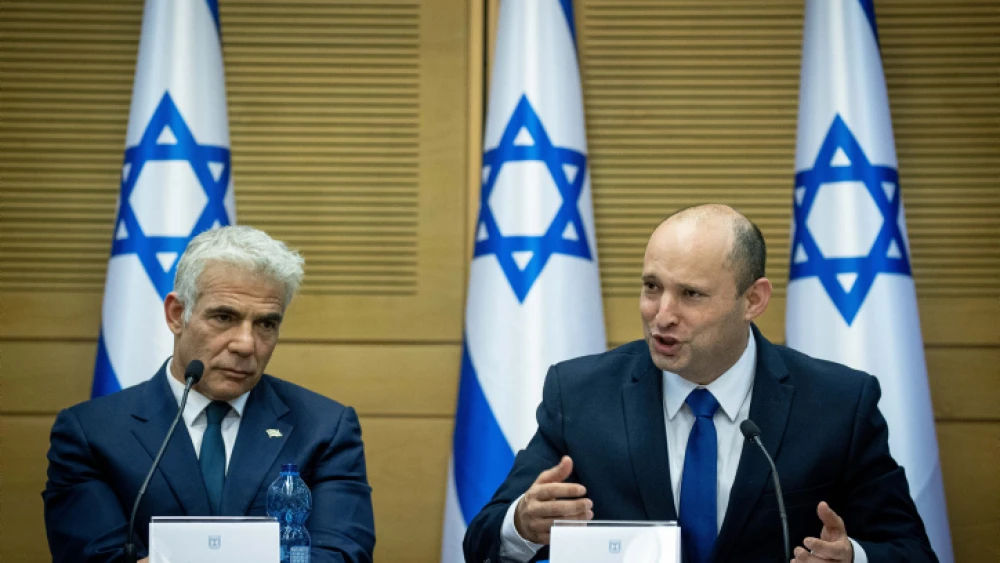 Israeli Prime Minister Naftali Bennett (right) and Foreign Minister Yair Lapid attend a Knesset meeting on June 13, 2021. Photo by Yonatan Sindel/Flash90.