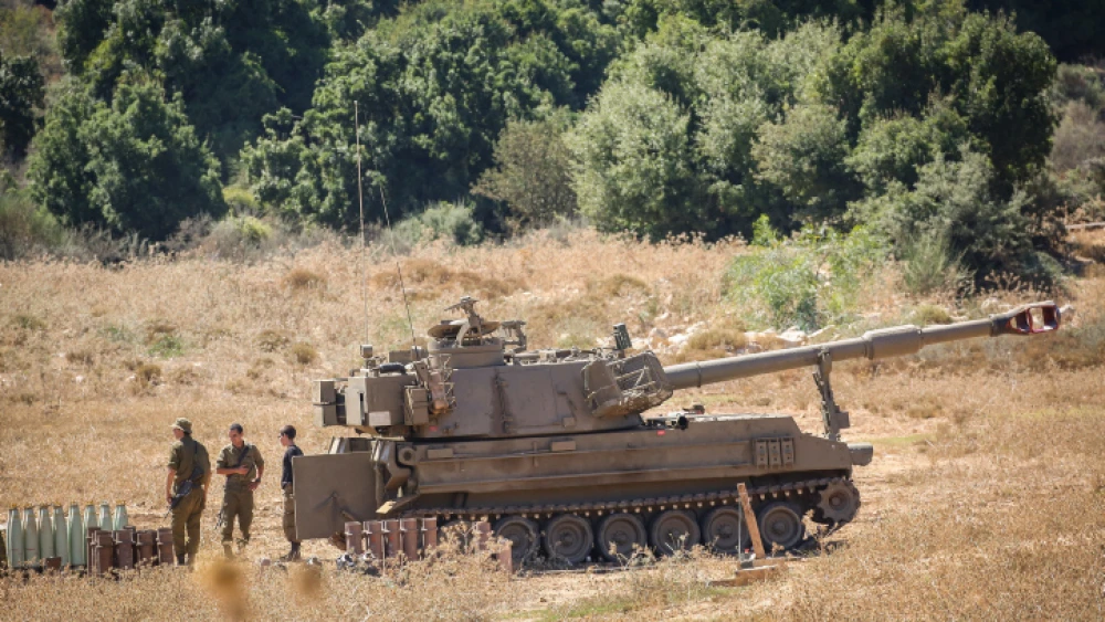 Israeli soldiers stand near artillery units deployed near the Lebanese border northern Israel on August 26, 2020. Photo by David Cohen/Flash90.