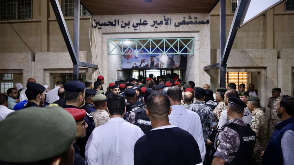People gathering at the entrance of Prince Ali Bin al-Hussein hospital in Karak after gunmen opened fire on a funeral at a church in Hmoud, Jordan, on October 23, 2026. Photo by Salah Malkawi/Getty Images.