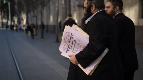 Representatives of the Chief Rabbinate of Israel deliver a kashrut certificate to a local restaurant, in central Jerusalem, on Dec. 31, 2019. Photo by Hadas Parush/Flash90.