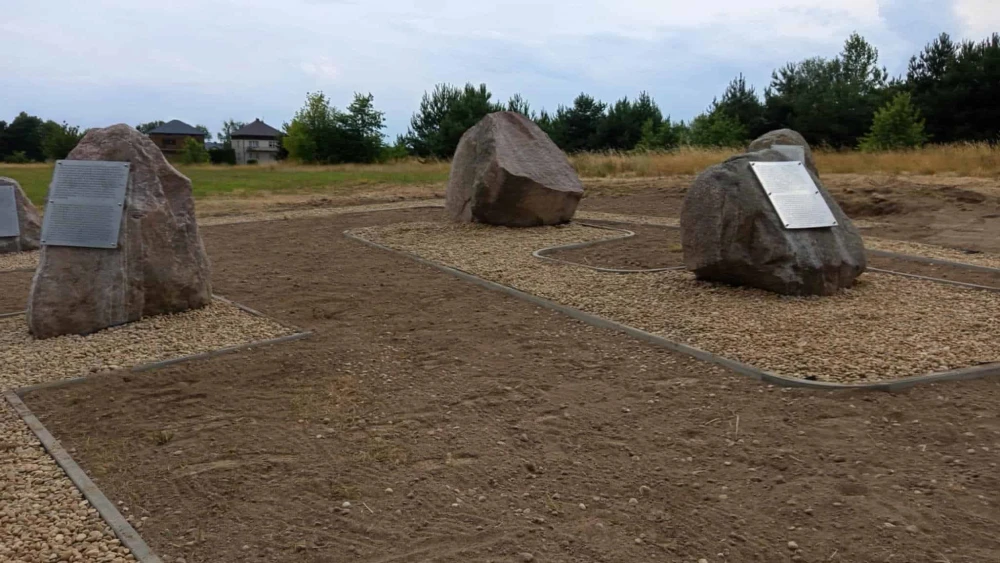 Boulders bearing ahistorical, revisionist text about the 1941 massacre in Jedwabne are on display next to the official commemorative site in eastern Poland on July 7, 2025. Photo by Kamil Mrozowicz.