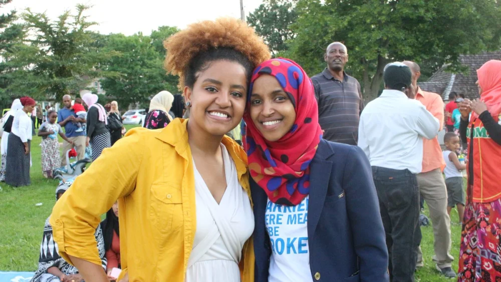 Democratic Party candidate for Congress Ilhan Omar (right), a Somali American who represents Minnesota, appears alongside a supporter at a Fourth of July barbecue. Source: Ilhan Omar via Twitter.