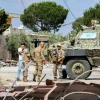 Lebanese army soldiers with a TAG Gladiator II MRAP (Mine-Resistant Ambush Protected vehicle) set up a checkpoint at the entrance to Al-Ghandouriyah in Southern Lebanon, preventing people from crossing toward villages where the Israeli military is believed to have deployed, on June 15, 2026. Photo by Mahmoud Zayyat/AFP via Getty Images.