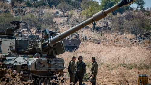 Israeli soldiers stand next to artillery units near the Lebanese border in northern Israel, on Sept. 1, 2019. Photo by Basel Awidat/Flash90.
